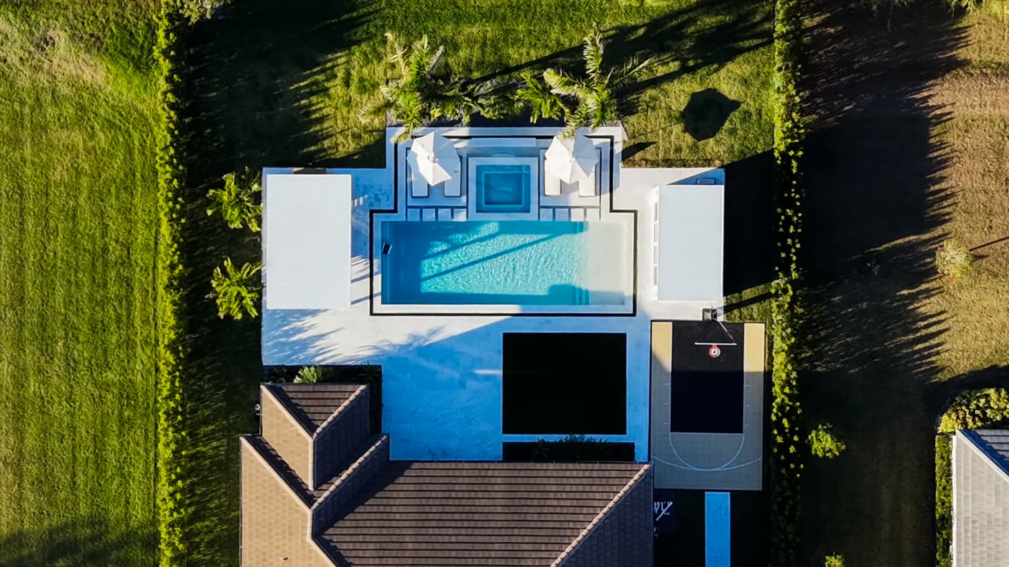 Aerial view of a renovated modern pool with deck
