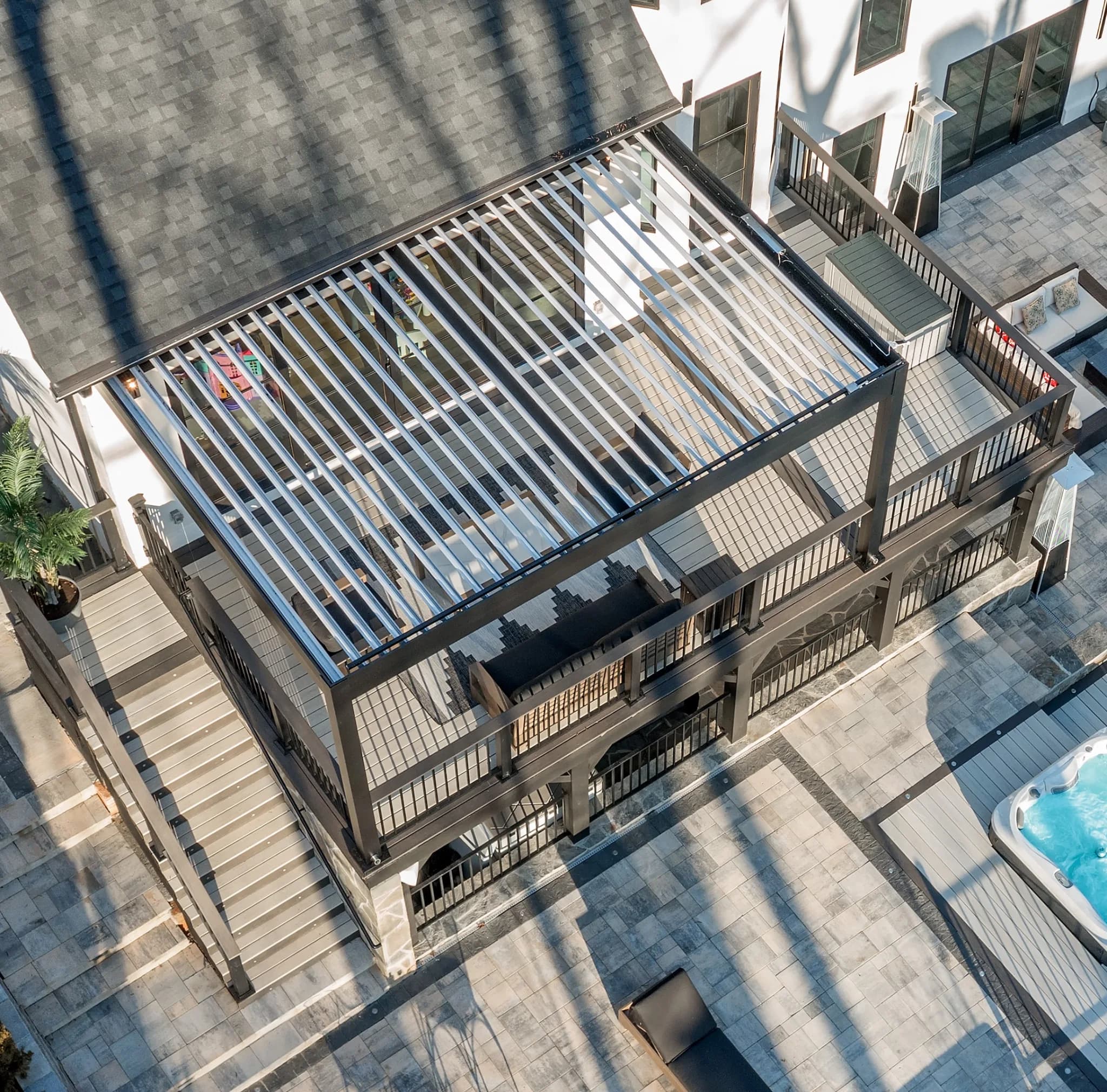R-BLADE aerial view over a luxury pool deck